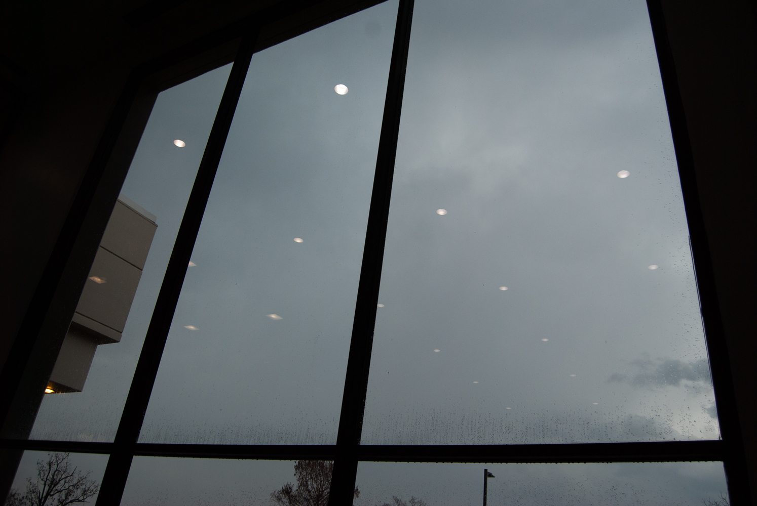 lights in a stormy sky forming a cross